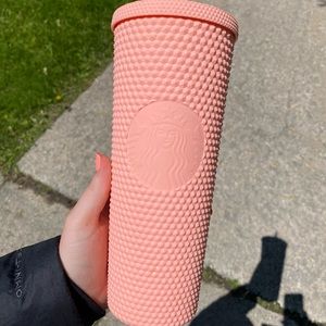 Pink studded Starbucks cup